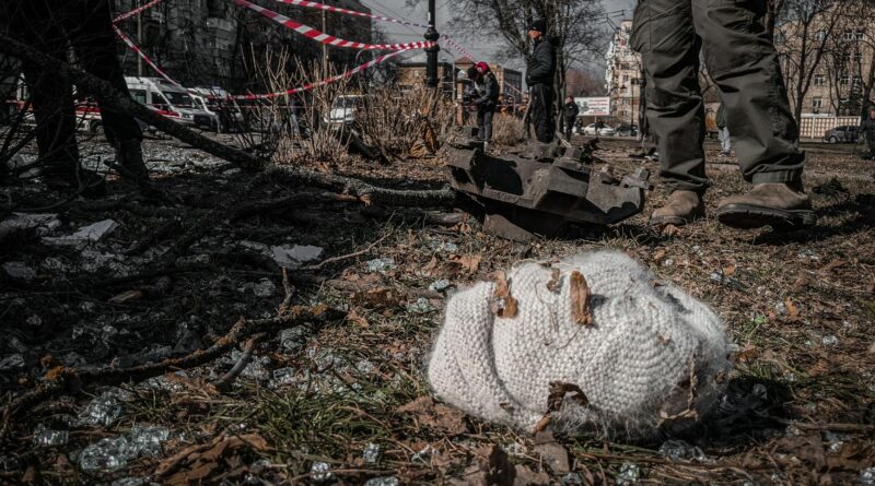 knitted hat lying among debris in ukrainian city